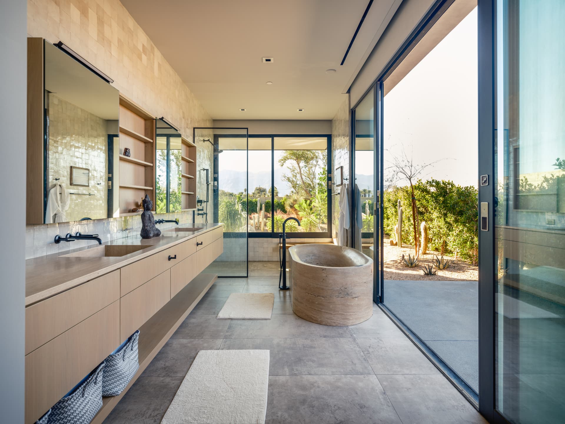 Primary bathroom opening to the desert garden at 3 Echo Lane