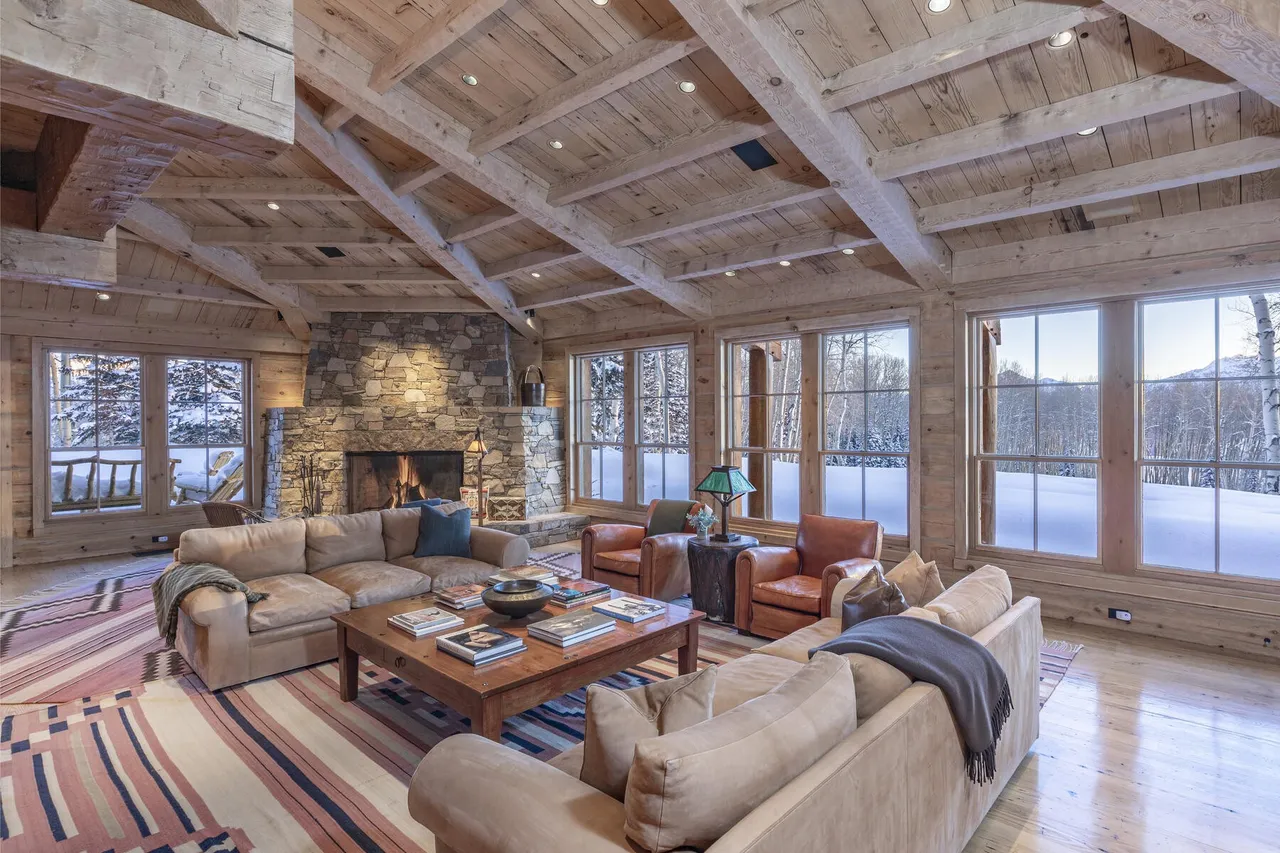 Living room and stone fireplace at 115 Francisco Way