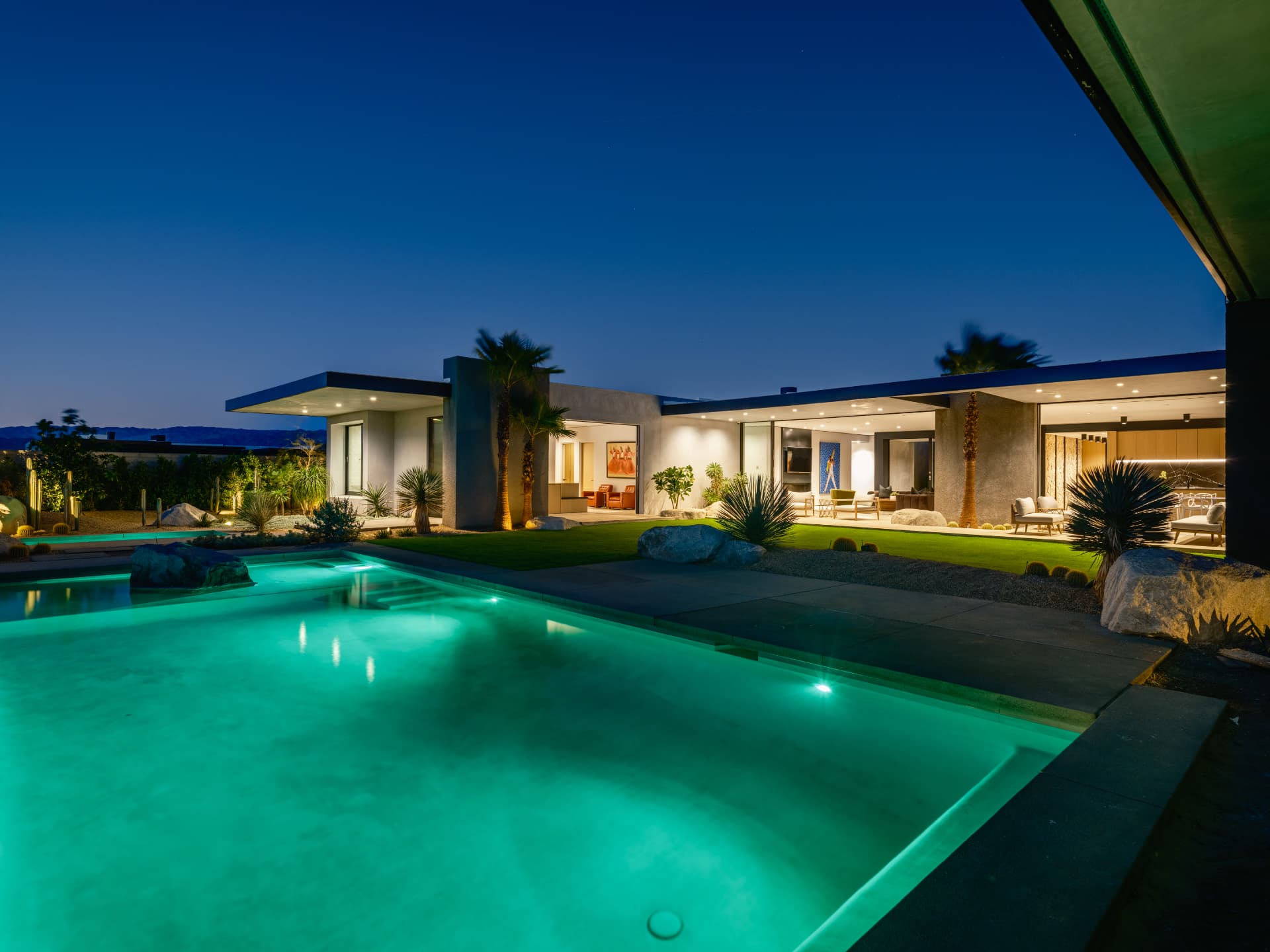 Illuminated pool and courtyard at 3 Echo Lane