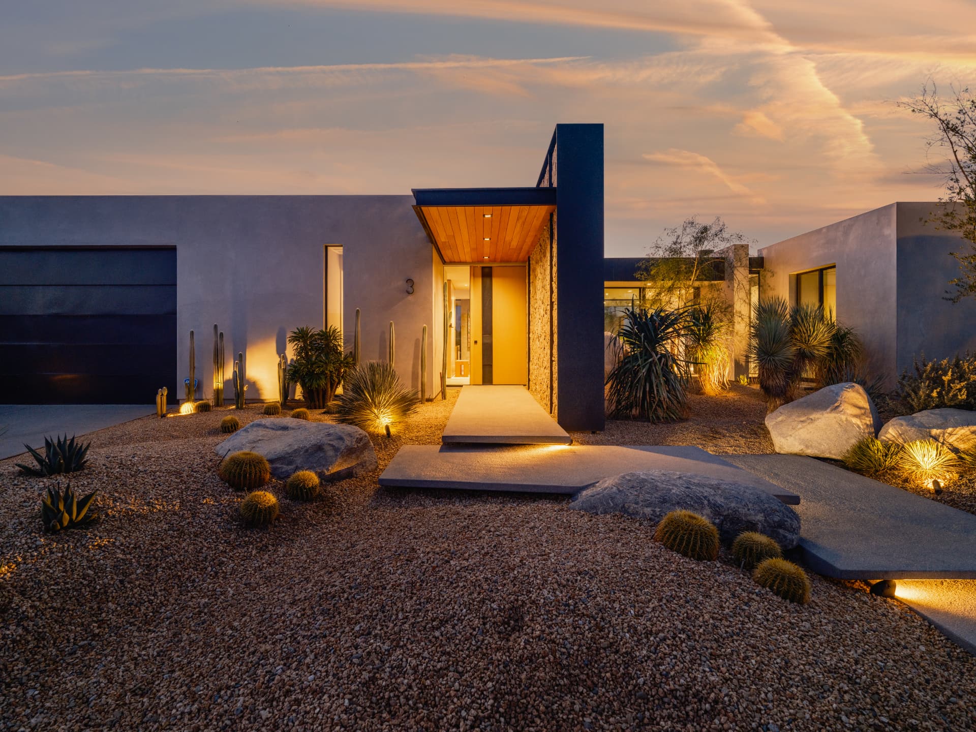 Illuminated entrance and desert landscaping at 3 Echo Lane
