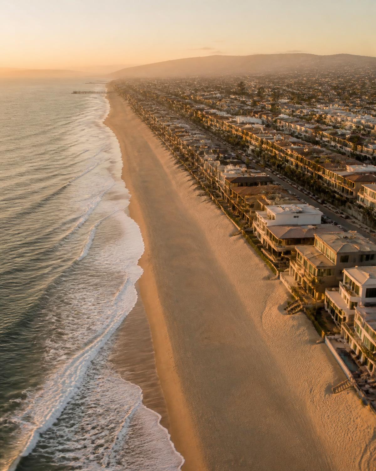 Aerial view of the Manhattan Beach coastline at golden hour